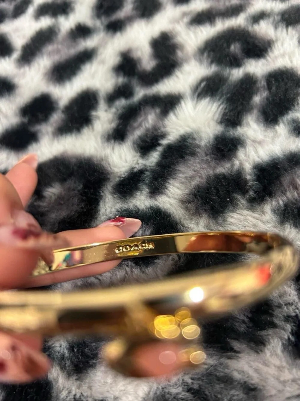 Coach Gold Bangle Bracelet with Coral Charm
